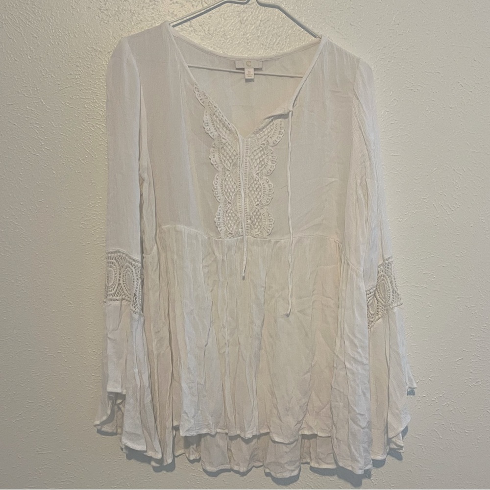 White blouse with long bell sleeves